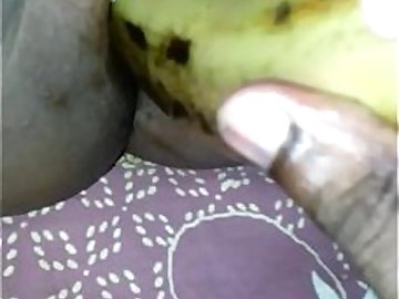 Tamil girl play with banana